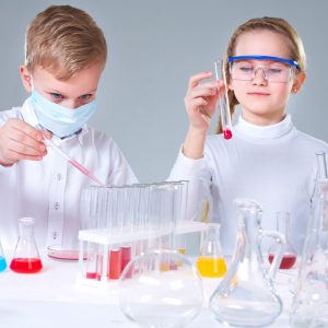 Team of young prodigies conducting scientific experiments